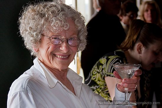 Gail Daly offers a toast with one of her freshly made martinis.