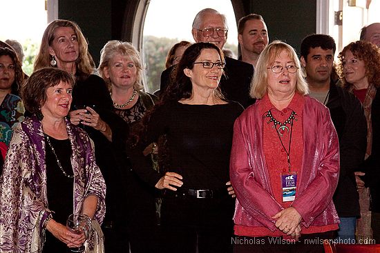 Toni Orans, left, Betsy Ford and Pat Ferrero (wearing glasses) among the happy throng at the opening party.