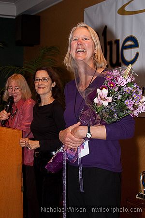 Mendocino Film Festival vice president Ann Walker with bouquet presented at the opening reception by Program Director Pat Ferrero and MFF vice president Betsy Ford.