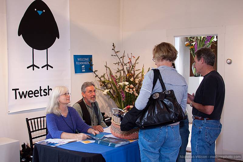 MFF volunteers Carole Freeman and James Sibbett greet arriving filmmakers.