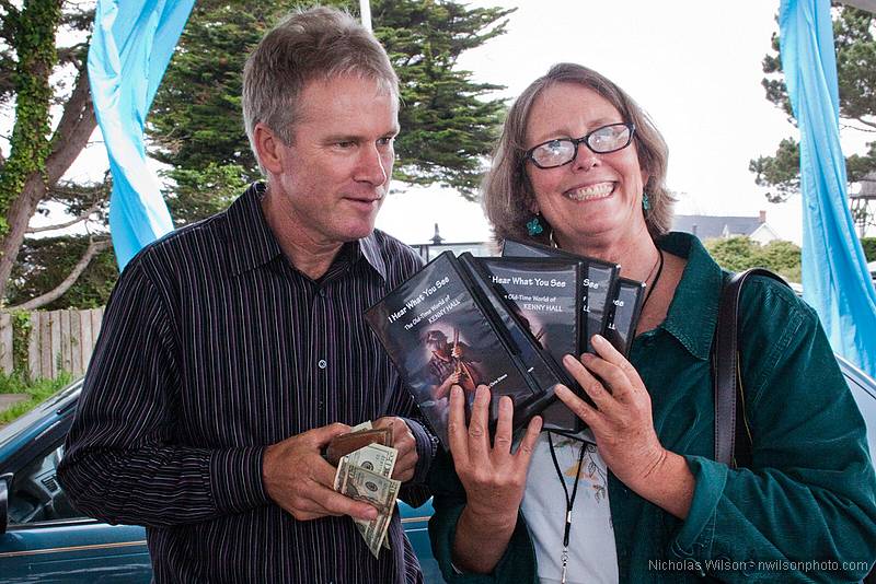 Filmmaker Chris Simon sells a batch of DVD's of her film I Hear What You See - The Old Time World of Kenny Hall after the showing at Crown Hall.