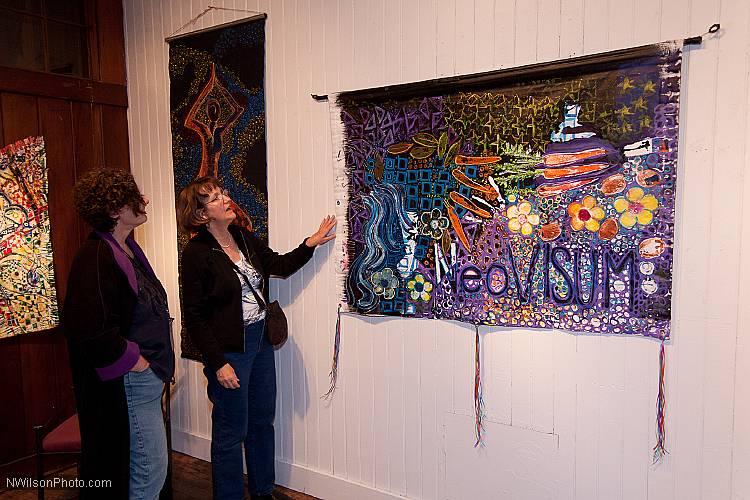 Artist Janet Self, left, showed her work in Oddfellows Hall, and provided colorful decor at all of the festival venues.