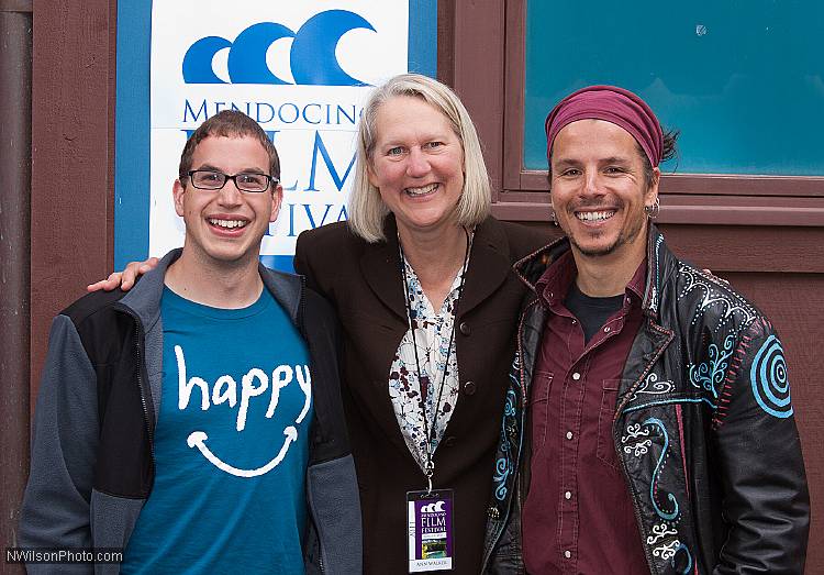 Mendocino Film Festival Vice President Ann Walker joins "Happy" associate producer Omid Heidari and director Roko Belic outside Matheson Hall.