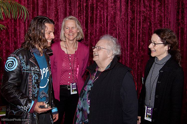 Roko Belic is congratulated by MFF Special Guest Ronnie Gilbert, singer, storyteller and one of The Weavers singing group with Pete Seeger.