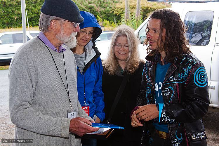 Filmmakers Les Blank, Gina Leibrecht, Maureen Gosling and Roko Belic swap some DVDs.