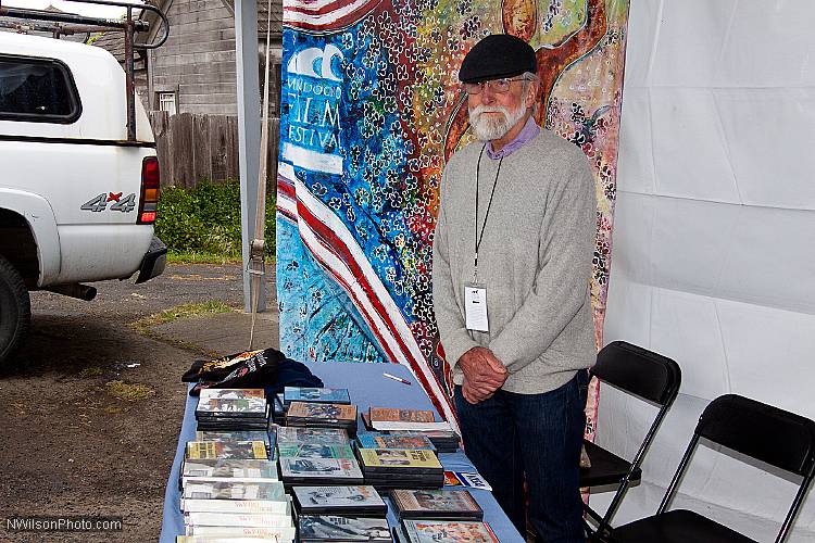 Maysles Award winner Les Blank at his DVD and t-shirt table outside Crown Hall.