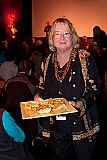 MFF Program Director Pat Ferrero serves freshly made garlic bread to audience members after a clip from Les Blank's film "Garlic Is As Good As Ten Mothers."