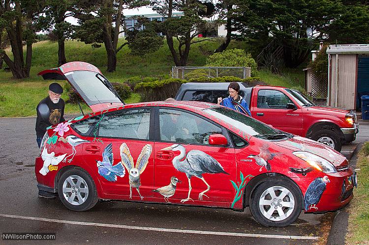 Les Blank loads his colorful car as the 6th annual Mendocino Film Festival draws to a close.  Les acquired the car with the help of his son Harrod Blank, who made a film about art cars.