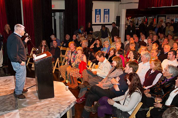 Paul Kemp welcomes the opening party audience in Crown Hall.