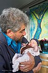 Producer Darryl Cherney cradles 6-week-old daughter Abigail, the youngest MFF attendee. Abby had her own guest pass.