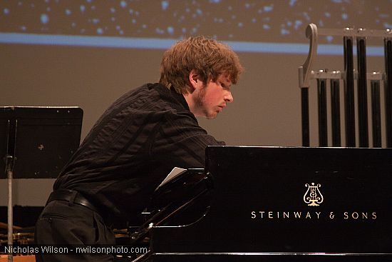 Julian Pollack plucks the piano strings by hand as directed by composer George Crumb