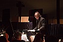 Allan Pollack prepares to conduct the orchestra for the opera Carmen