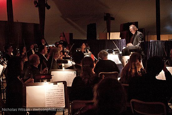 Allan Pollack prepares to conduct the orchestra for the opera Carmen.