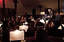 Allan Pollack prepares to conduct the orchestra for the opera Carmen.