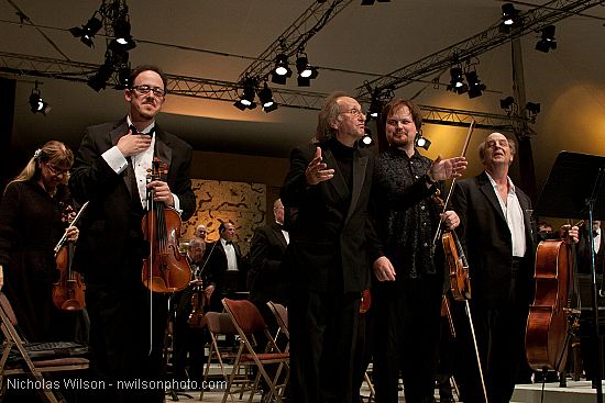 Festival orchestra members receive applause following Brahms' Symphony No. 4.