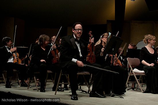 Festival orchestra members receive applause following Brahms' Symphony No. 4.