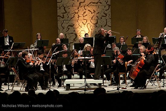 Festival orchestra members receive applause following Brahms' Symphony No. 4.