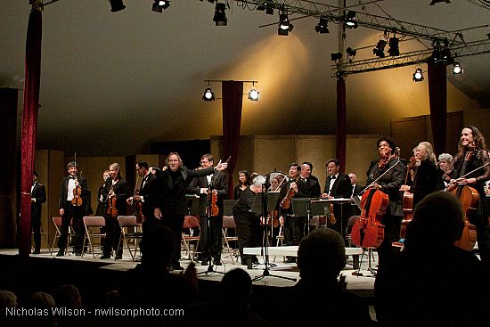 Festival orchestra members receive applause following Brahms' Symphony No. 4.