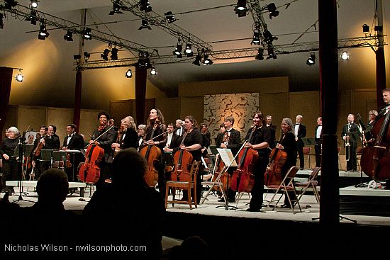 Festival orchestra members receive applause following Brahms' Symphony No. 4.