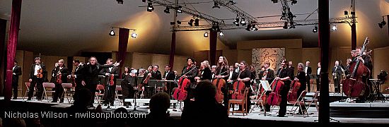 Festival orchestra members receive applause following Brahms' Symphony No. 4.