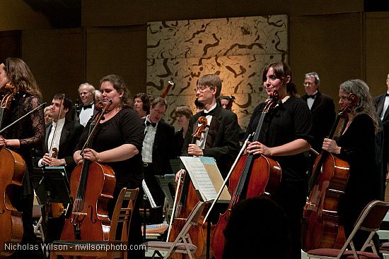 Festival orchestra members receive applause following Brahms' Symphony No. 4.