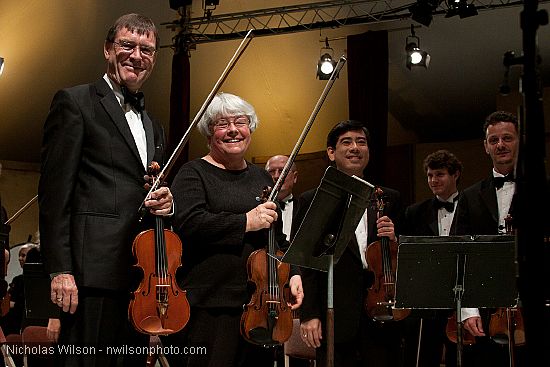 Festival orchestra members receive applause following Brahms' Symphony No. 4.