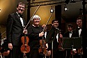 Festival orchestra members receive applause following Brahms' Symphony No. 4.