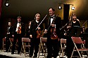 Festival orchestra members receive applause following Brahms' Symphony No. 4.