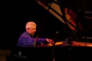 Mendocino Music Festival piano tecnician Ted Kidwell tunes the piano for Julian Pollack.