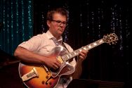 John Storie on guitar with the Julian Waterfall Pollack sextet.