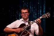 John Storie on guitar with the Julian Waterfall Pollack sextet.