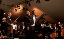 Pianist Spencer Myer, Conductor Allan Pollack and the whole orchestra take a bow after the Gershwin Concerto for Piano and Orchestra.