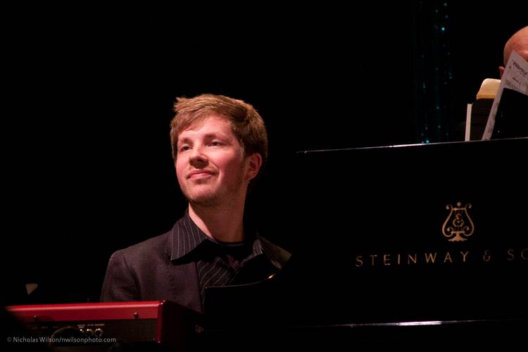 Julian Pollack on piano with the Big Band playing his arrangement.