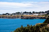 Town of Mendocino with the Mendocino Music Festival's big white 850-seat tent concert hall overlooking Mendocino Bay and the blue Pacific Ocean.