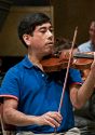 Rick Shinozaki, Principal Violin II, in rehearsal for the final concert.