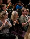 Mindy Rosenfeld, Principal Flute, center, in rehearsal.