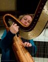 Tuning the harp after rehearsal.