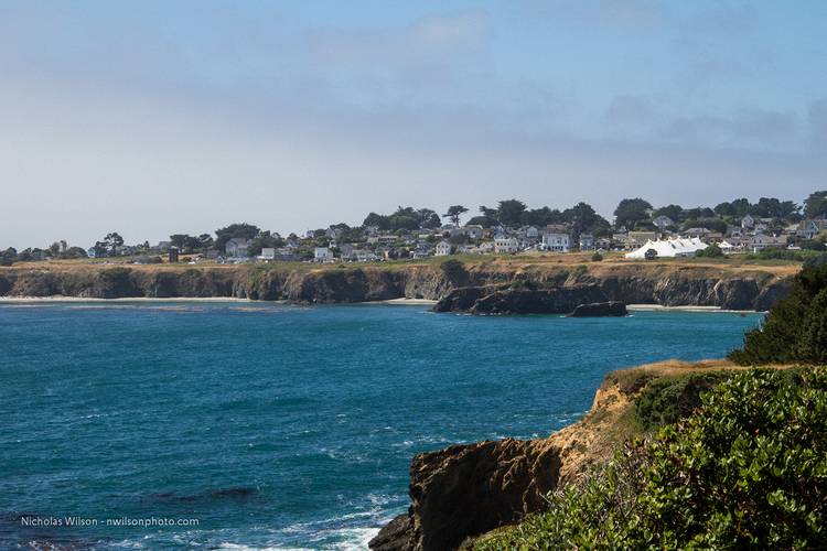 Mendocino, California, occupies a rocky headland jutting into the Pacific Ocean. The giant big top tent houses the Mendocino Music Festival's 850-seat concert hall during July each year.