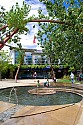 Kids enjoy playing in the fountain in the plaza of Real Goods.