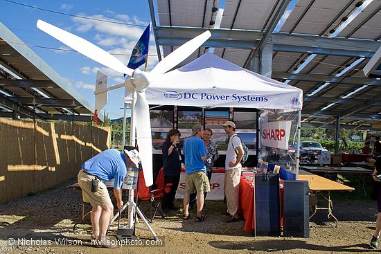 DC Power Systems showed a wind turbine and solar panels at SolFest 2007. Note the huge solar electric array overhead that provides power for Real Goods and shades the parking lot.