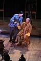 Schaunard pours liquor for landlord Benoit (Richard Goodman, baritone) who has come to collect the rent.