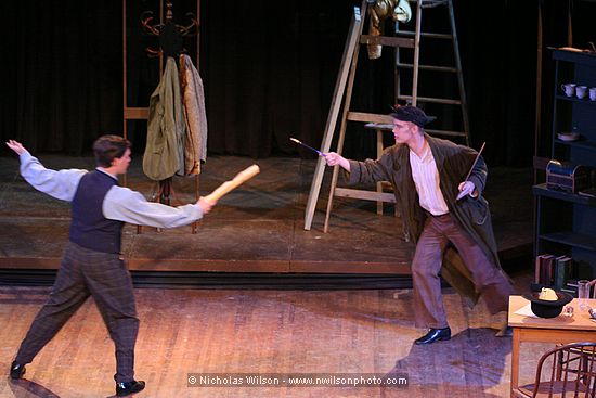 Schaunard and Colline play at fencing with a baguette and an artist's paintbrush.