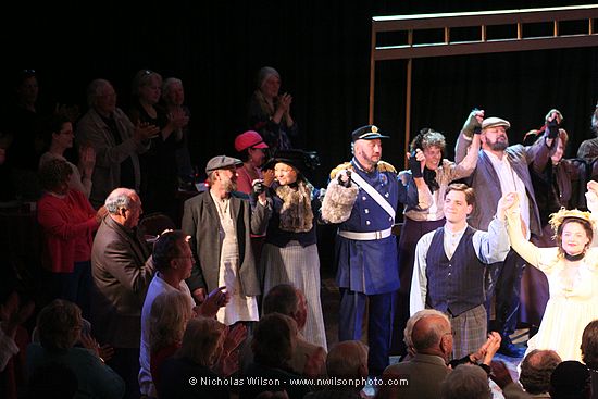 Chorus members and John Dooley (Schaunard) and Kresha Faber (Musetta).