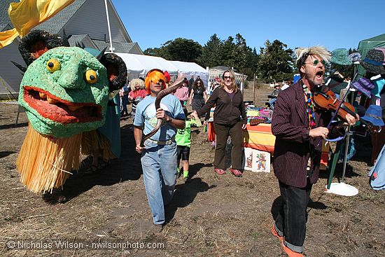 Joe Craven and Gertie the Gorse Monster lead a parade through CasparFest.