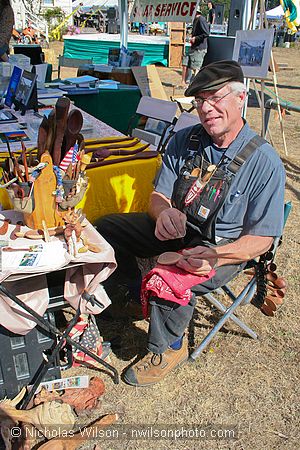 Wooden spoon craftsman at CasparFest marketplace.