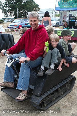 Steven Heckeroth gives kids a ride on his electric crawler mini-tractor at CasparFest 2007