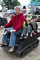 Steven Heckeroth gives kids a ride on his electric crawler mini-tractor at CasparFest 2007