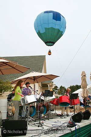 Kevin and the Coconuts play as hot air balloon rides happen in the background.