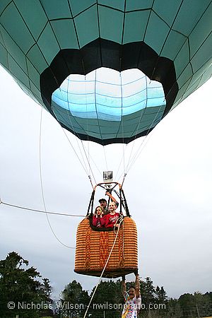 Kevin Herschman and passengers lift off in his hot air balloon