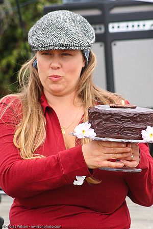 Yarrow displays a cake at auction